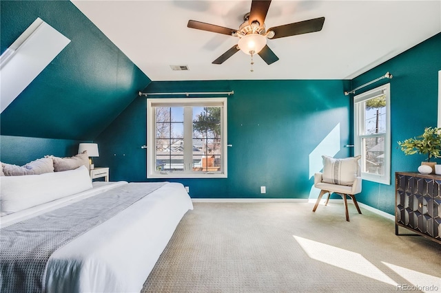 bedroom with visible vents, carpet, baseboards, ceiling fan, and vaulted ceiling