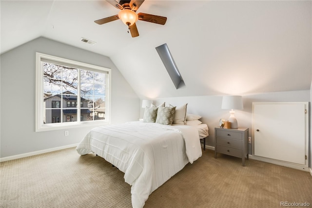 bedroom featuring lofted ceiling, light colored carpet, visible vents, and baseboards