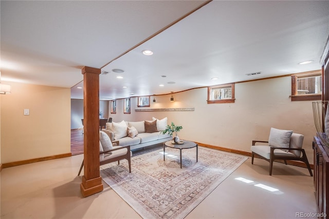 living area featuring recessed lighting, visible vents, ornate columns, and baseboards