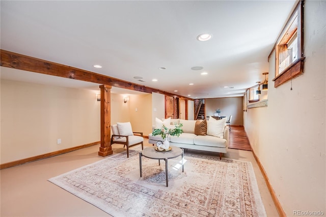 living room featuring recessed lighting and baseboards