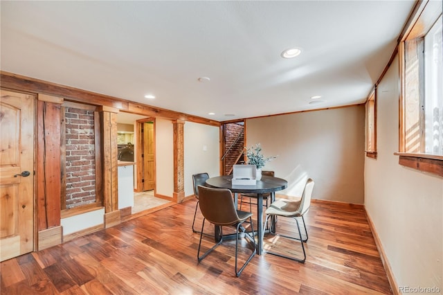 dining space with stairway, recessed lighting, and light wood-type flooring