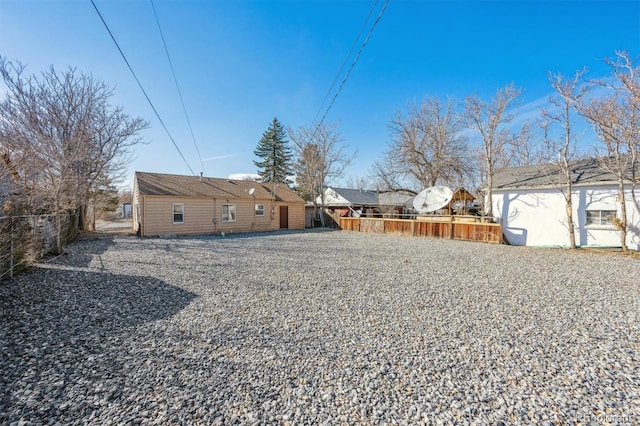 back of property featuring a fenced backyard