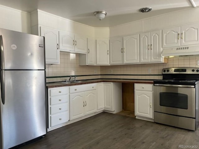 kitchen with white cabinets, stainless steel appliances, decorative backsplash, sink, and dark hardwood / wood-style floors