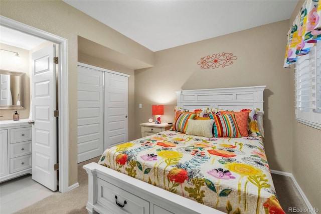 30 Stewart Way, Erie, CO 80516 - bedroom featuring light colored carpet, a closet, and baseboards