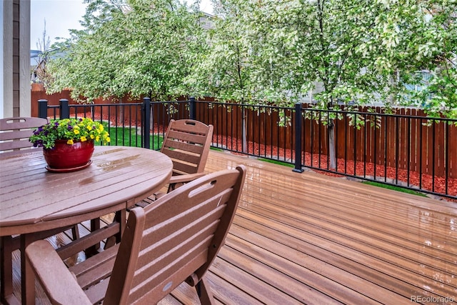 30 Stewart Way, Erie, CO 80516 - wooden terrace featuring outdoor dining space and a fenced backyard