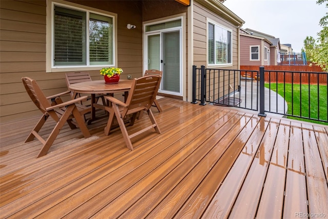 30 Stewart Way, Erie, CO 80516 - wooden terrace with outdoor dining space and fence