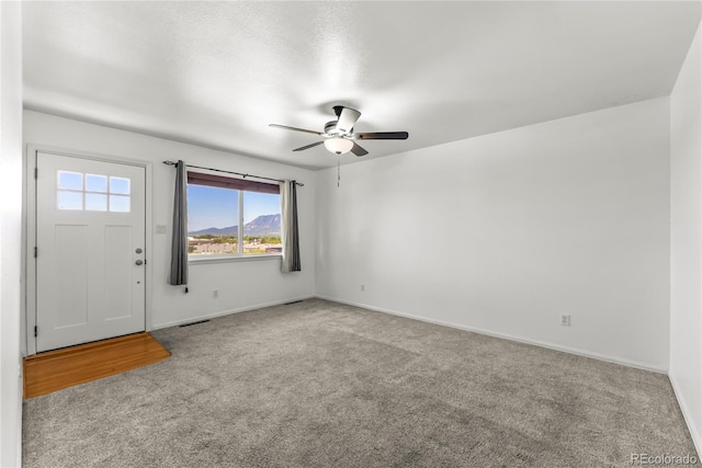 3118 E San Miguel St, Colorado Springs, CO 80909 - carpeted empty room with ceiling fan and baseboards