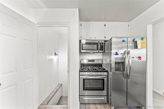 3118 E San Miguel St, Colorado Springs, CO 80909 - kitchen with stainless steel appliances and white cabinets