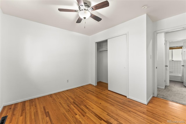 3118 E San Miguel St, Colorado Springs, CO 80909 - unfurnished bedroom featuring baseboards, wood finished floors, a closet, and a ceiling fan