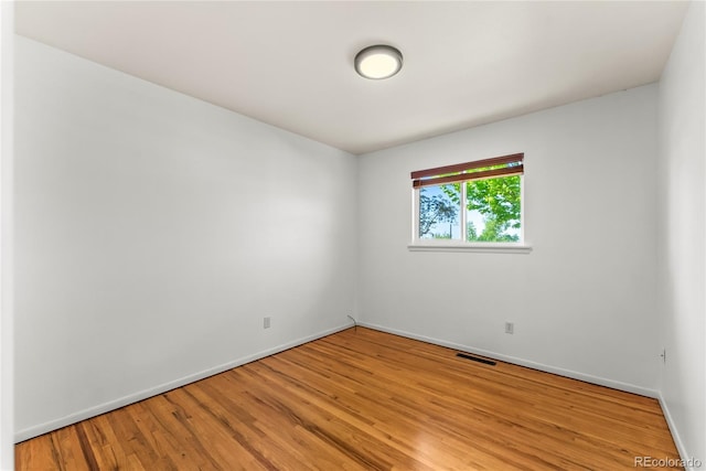 3118 E San Miguel St, Colorado Springs, CO 80909 - empty room with baseboards and light wood-style floors