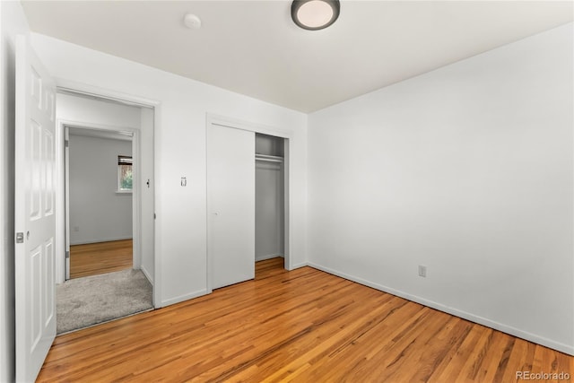 3118 E San Miguel St, Colorado Springs, CO 80909 - unfurnished bedroom featuring light wood-style floors, a closet, and baseboards