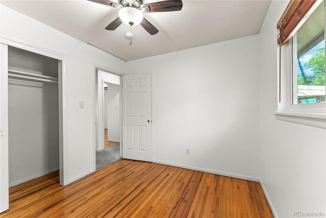 3118 E San Miguel St, Colorado Springs, CO 80909 - unfurnished bedroom with baseboards, wood finished floors, a closet, and a ceiling fan