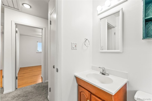 3118 E San Miguel St, Colorado Springs, CO 80909 - bathroom featuring vanity, toilet, and baseboards