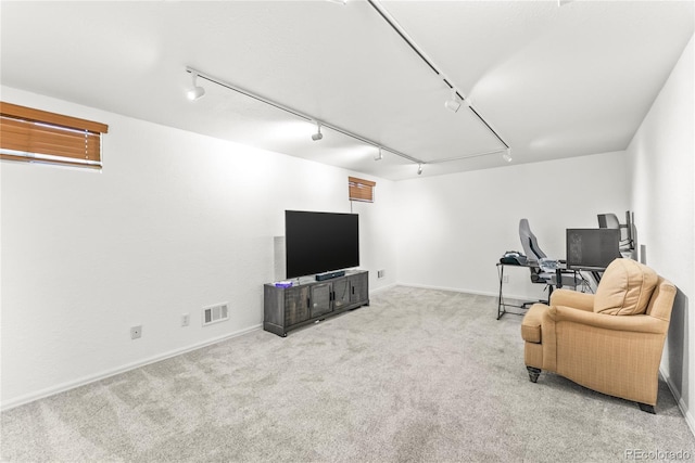 3118 E San Miguel St, Colorado Springs, CO 80909 - living area with carpet floors, baseboards, rail lighting, and attic access