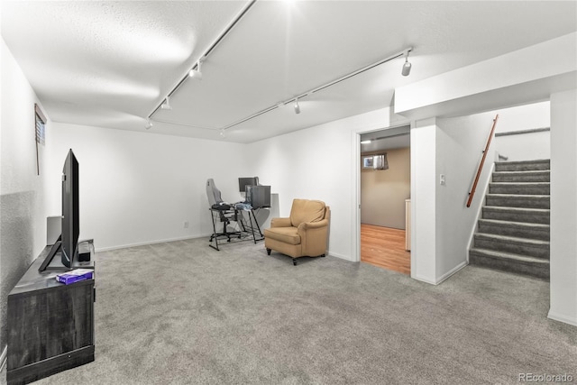 3118 E San Miguel St, Colorado Springs, CO 80909 - sitting room featuring rail lighting, carpet floors, stairway, and baseboards