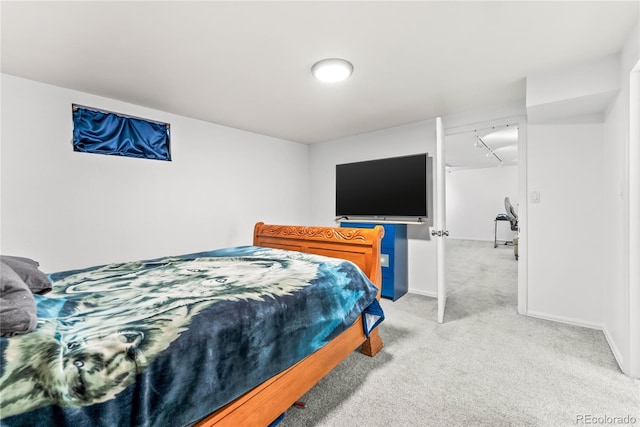 3118 E San Miguel St, Colorado Springs, CO 80909 - bedroom featuring light carpet and baseboards