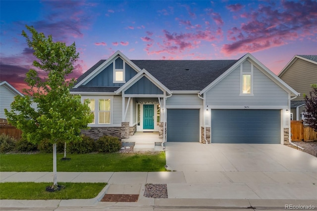 5651 Gore Creek Pl, Brighton, CO 80601 - craftsman inspired home with board and batten siding, stone siding, and driveway