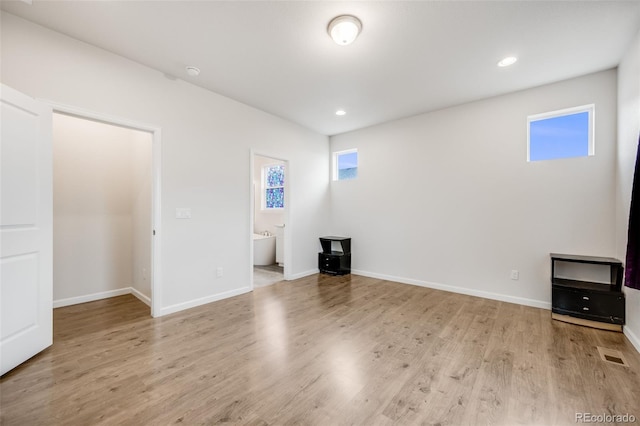 5651 Gore Creek Pl, Brighton, CO 80601 - unfurnished living room featuring plenty of natural light, wood finished floors, and recessed lighting