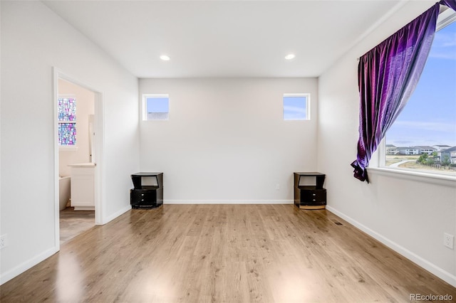 5651 Gore Creek Pl, Brighton, CO 80601 - unfurnished room with plenty of natural light, wood finished floors, and recessed lighting