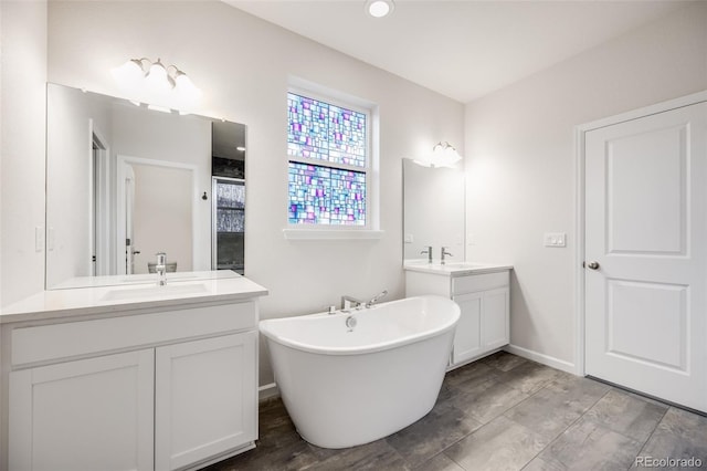 5651 Gore Creek Pl, Brighton, CO 80601 - full bath with two vanities and a freestanding bath