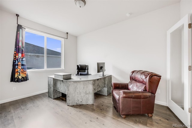 5651 Gore Creek Pl, Brighton, CO 80601 - home office with wood finished floors