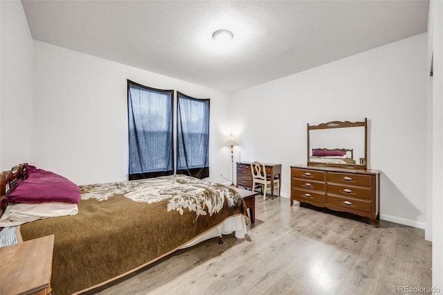 5651 Gore Creek Pl, Brighton, CO 80601 - bedroom featuring wood finished floors and baseboards