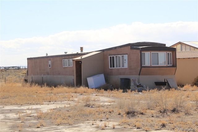 view of side of home featuring stucco siding