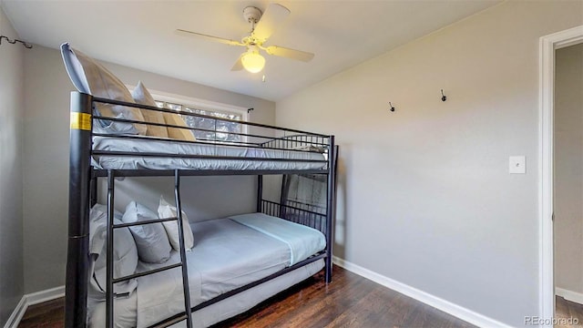 unfurnished bedroom featuring dark hardwood / wood-style flooring and ceiling fan