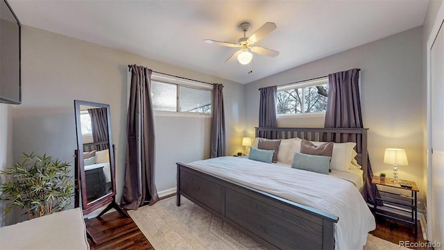 bedroom featuring ceiling fan, dark hardwood / wood-style floors, and vaulted ceiling