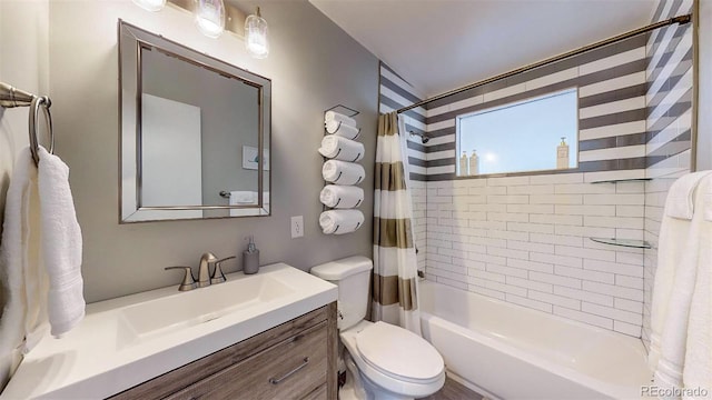 full bathroom featuring vanity, toilet, and shower / bathtub combination with curtain