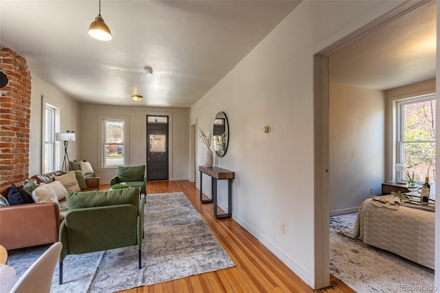 604 W 1st St, Salida, CO 81201 - living room featuring light wood-style flooring, plenty of natural light, and baseboards