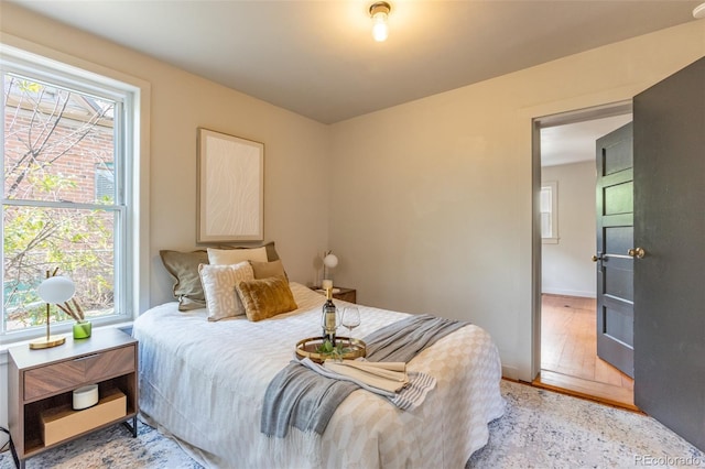604 W 1st St, Salida, CO 81201 - bedroom with multiple windows, light wood finished floors, and baseboards
