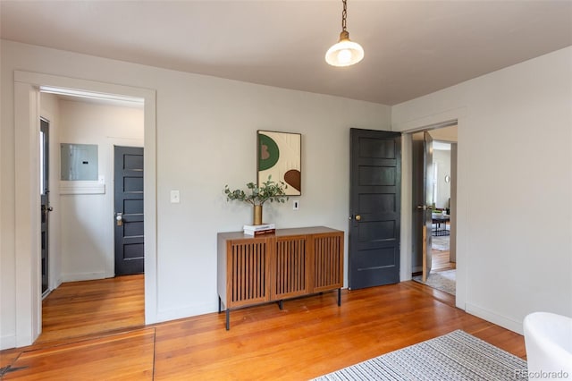 604 W 1st St, Salida, CO 81201 - bedroom with light wood-type flooring, electric panel, and baseboards