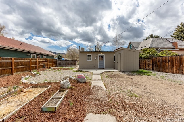 604 W 1st St, Salida, CO 81201 - rear view of property with a garden, a patio, and a fenced backyard