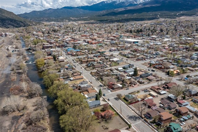604 W 1st St, Salida, CO 81201 - aerial overview of property's location with a mountainous background and nearby suburban area