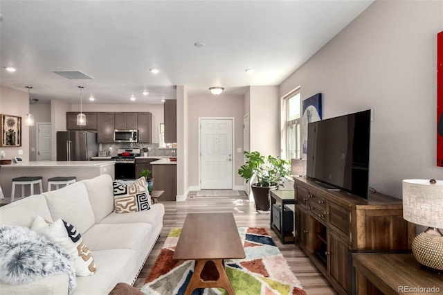 12673 Tamarac St, Thornton, CO 80602 - living room with light wood-style floors and recessed lighting