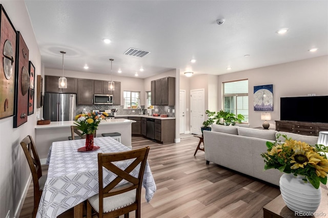12673 Tamarac St, Thornton, CO 80602 - dining space with light wood finished floors and recessed lighting