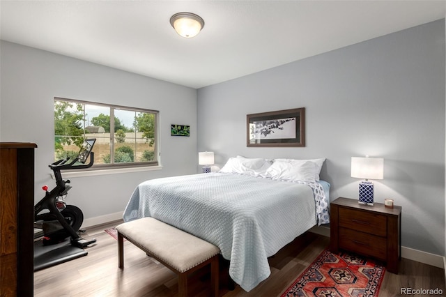 12673 Tamarac St, Thornton, CO 80602 - bedroom featuring wood finished floors and baseboards