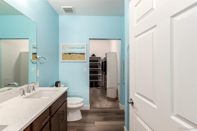12673 Tamarac St, Thornton, CO 80602 - bathroom with wood finished floors and vanity