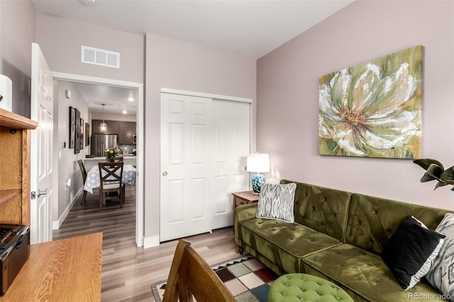 12673 Tamarac St, Thornton, CO 80602 - living area featuring wood finished floors and baseboards
