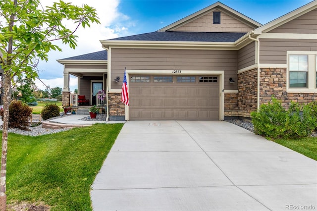 12673 Tamarac St, Thornton, CO 80602 - craftsman inspired home featuring stone siding, a garage, a front lawn, concrete driveway, and a shingled roof