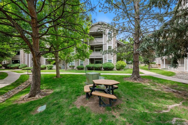 8378 S Upham Way Unit B205, Littleton, CO 80128 - surrounding community with a lawn