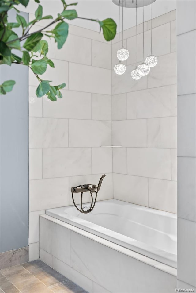 full bathroom featuring tile walls and a tub to relax in