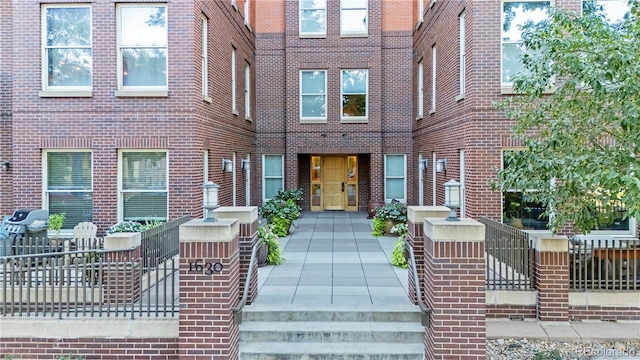 view of front of home featuring brick siding