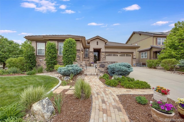 view of front of property with a garage and a front yard