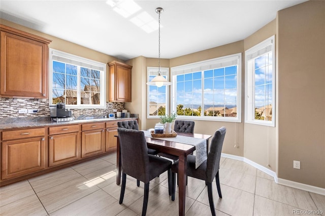 tiled dining space with a wealth of natural light