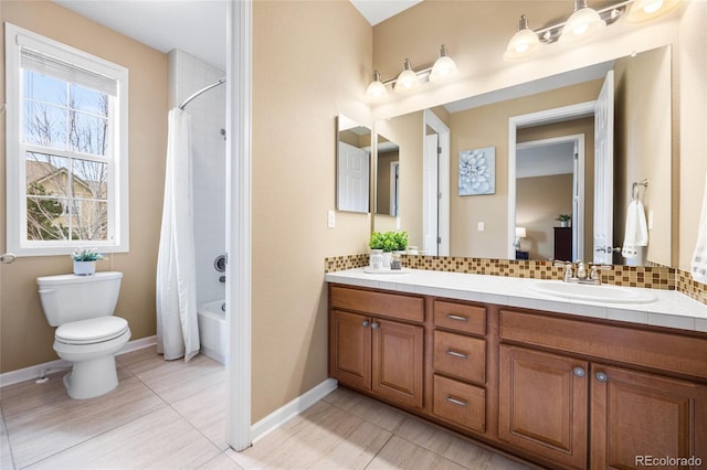 full bathroom featuring tasteful backsplash, vanity, toilet, tile patterned floors, and shower / tub combo with curtain