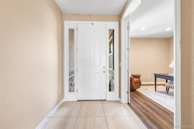 foyer featuring light tile patterned floors