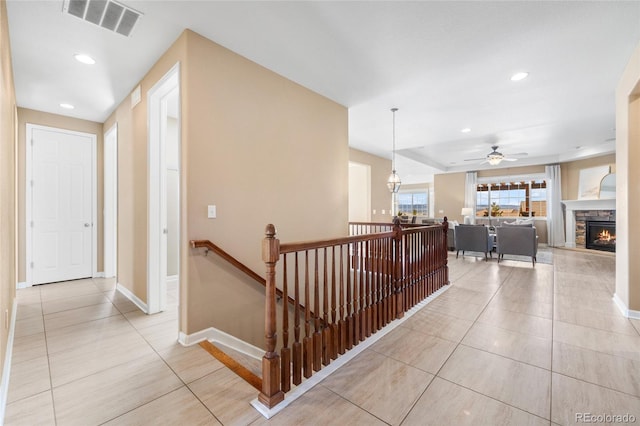 hallway with light tile patterned floors