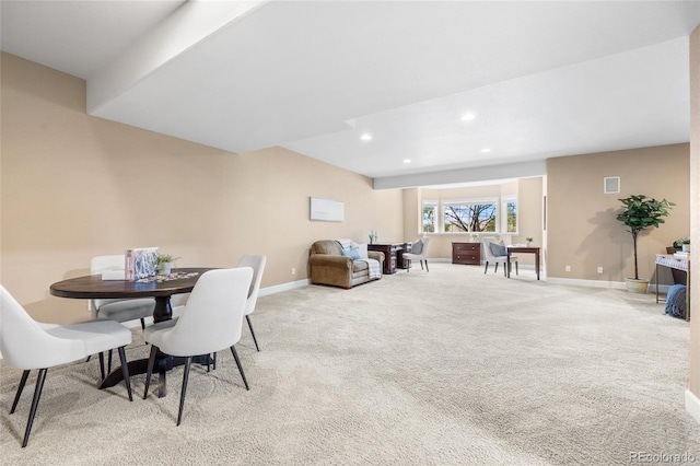 view of carpeted dining area